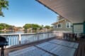 Modern vacation rental home overlooking a scenic lake in Cleveland, Ohio, with a beautiful panoramic view.
