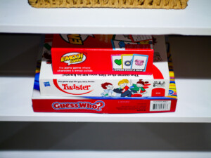 Holiday family playing board games together in a cozy Northeast Ohio vacation rental living room.