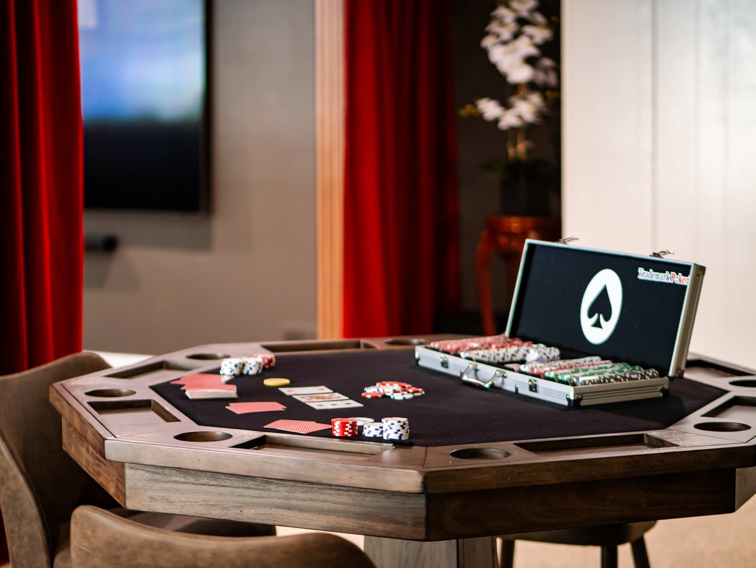 short-term rental basement game room with poker table and entertainment space