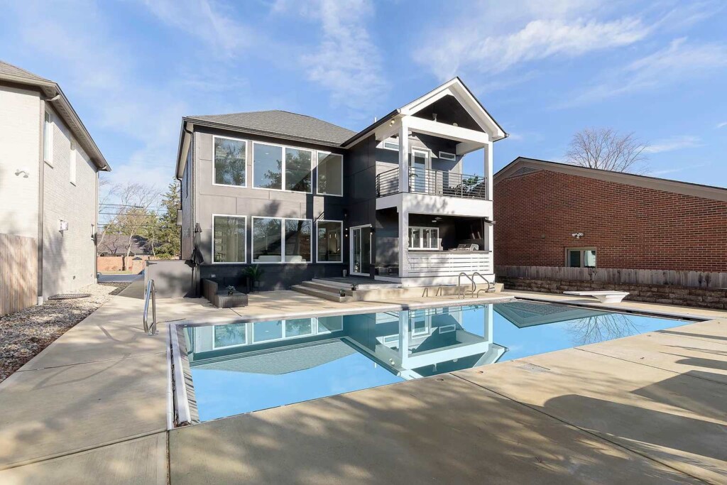 Luxury Ohio short-term rental home with mansion backyard pool and outdoor entertaining space