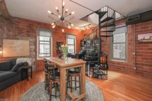 entertainers bar and lounge area with seating for guests in short term rental home