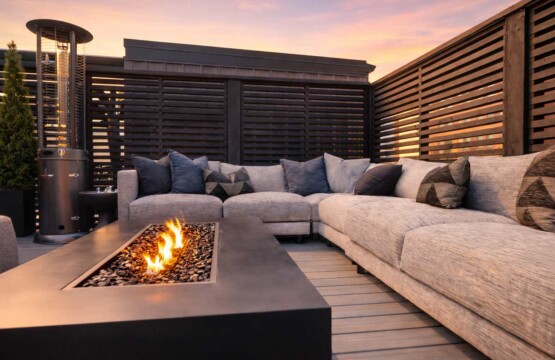 rooftop patio with firepit and seating overlooking city skyline for short term rental