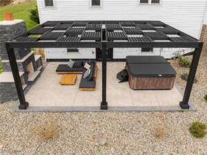 backyard patio with hot tub seating area and shade for short term rental guests