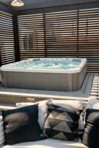 Rooftop Hot Tub with Private City Views rooftop hot tub with privacy seating and downtown city views for short term rental