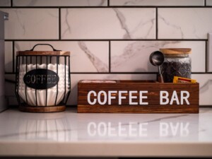 Thoughtfully stocked coffee bar in a vacation rental with coffee maker, mugs, and morning essentials for guests