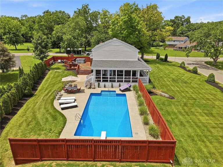 Family-friendly vacation rental with fenced backyard, inground pool, deck, and private hot tub