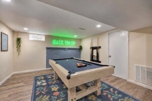 Holiday Vacation Rental Game Room with Pool Table Game room with neon lights and pool table in a holiday vacation rental
